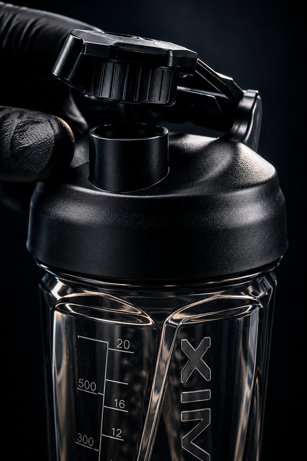 Close-up of the black flip-top lid and drinking spout on the Model H shaker.