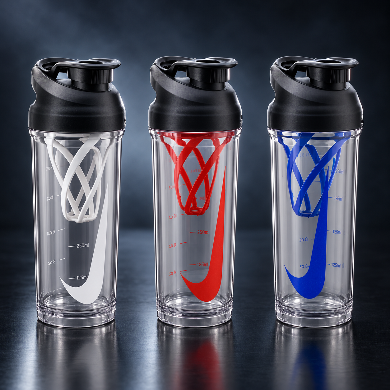 Three Model N crystal-clear sports shakers with black, red and blue designs in cinematic studio lighting.
